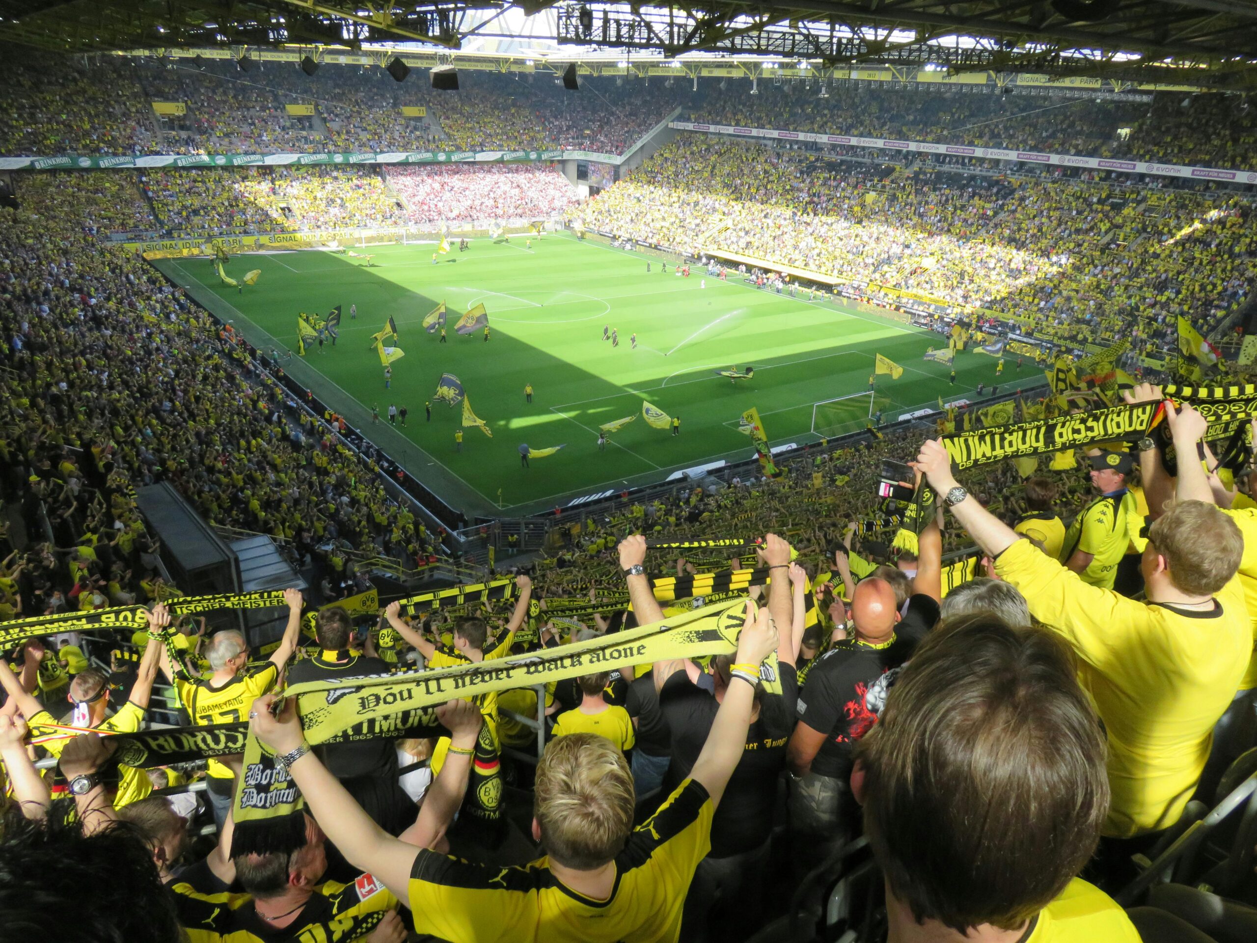 A sport stadium with crowds cheering